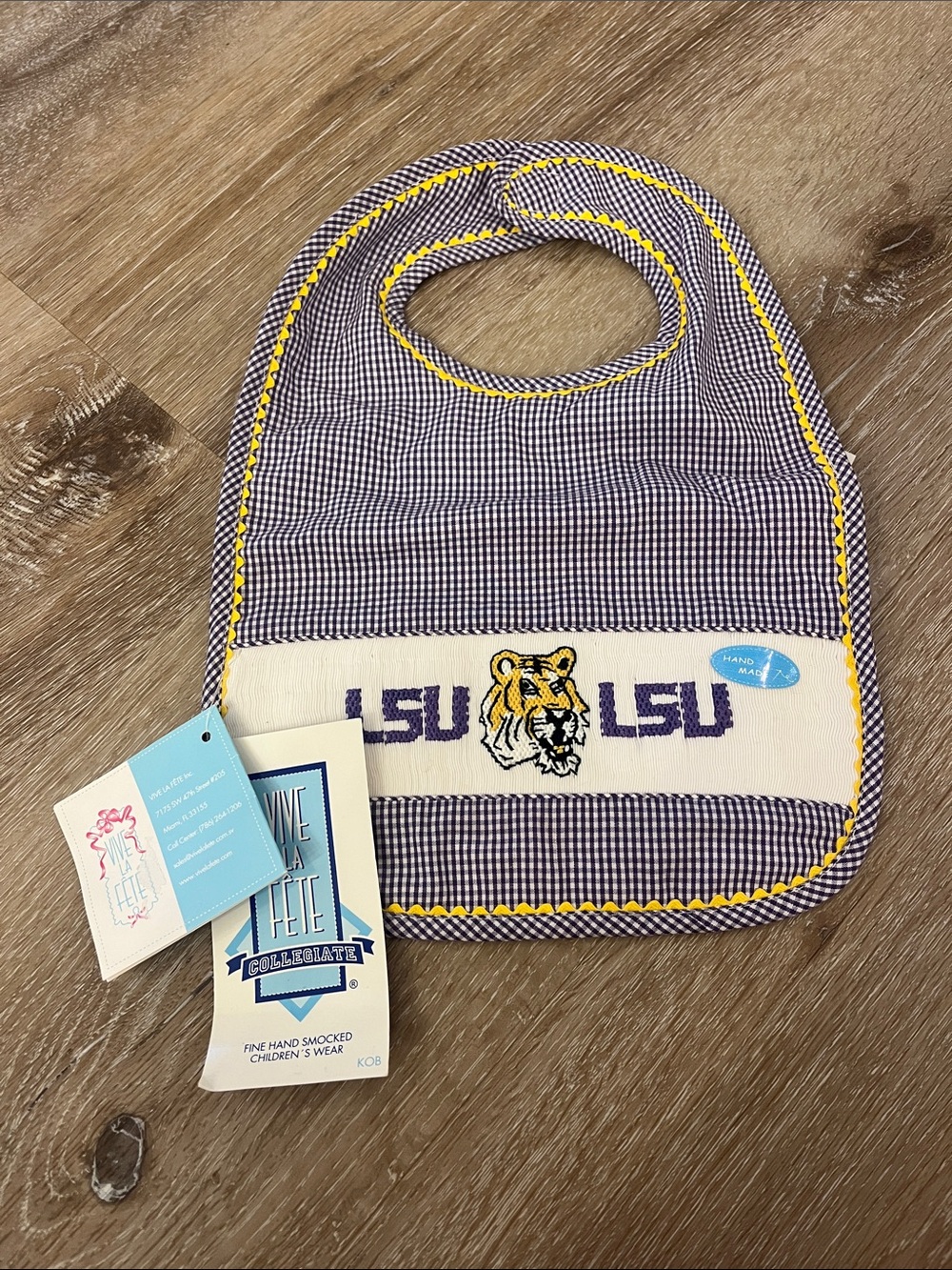 LSU Gingham Hand Smocked Baby Bib in Purple & Gold